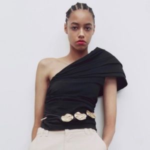 Black asymmetric one shoulder black top, super cute on! Dresses up or down.
